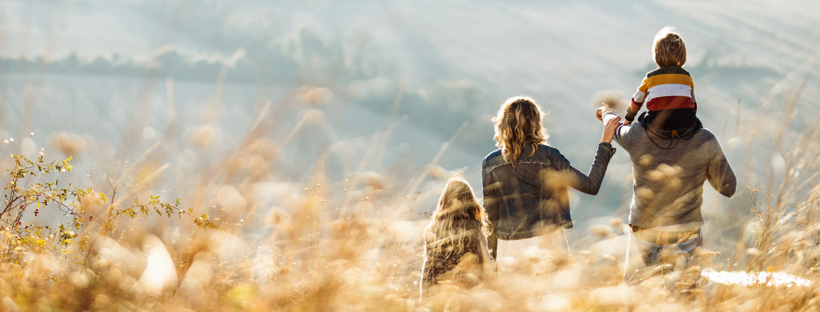 Young family looking out over rolling hills